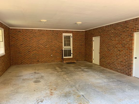 Garage with two large utility closets.
