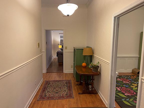 Entrance hall with living/dining room to the right. Den/living room straight ahead. Either room could be an office also.