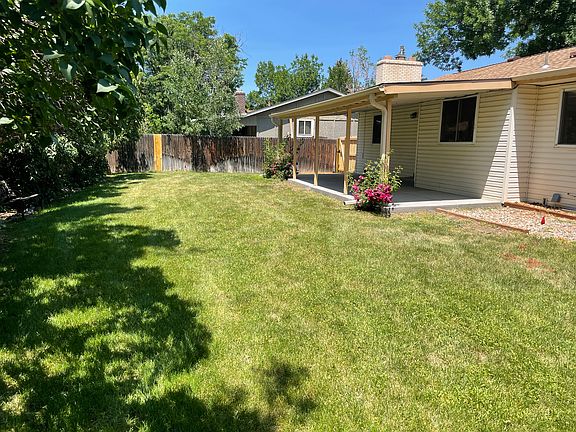 Back Yard, Fully Privacy Fenced;
Lilac bushes along back;