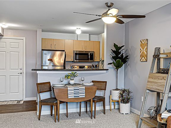 Wide granite kitchen counters with overhang can also function as counter seating. 