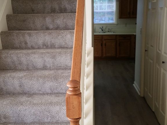 Hallway to kitchen and stairs to upper floor