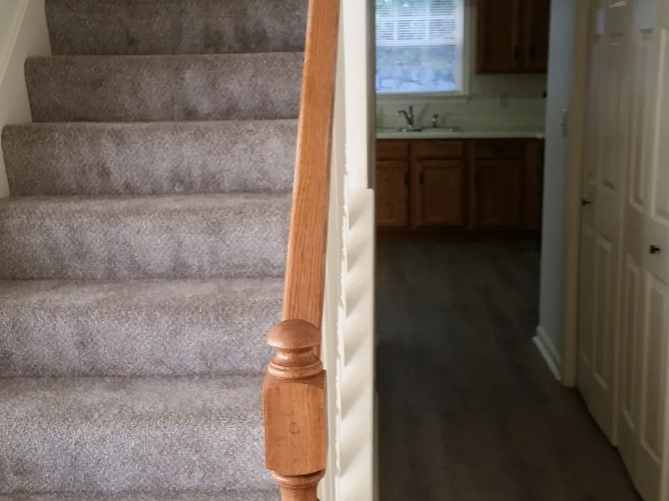 Hallway to kitchen and stairs to upper floor