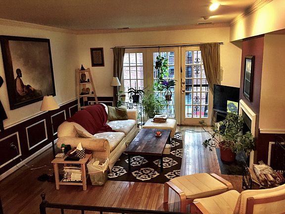 Living room with windows facing the sun.