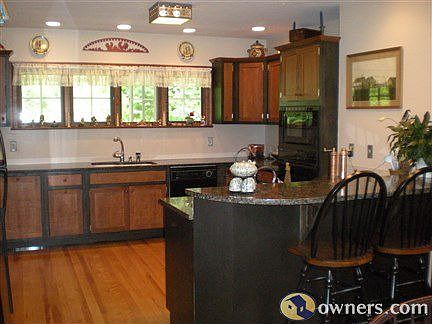 Cherry/ebony cabinetry,kitchen bar