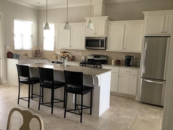 Spacious, updated kitchen with island seating. Refrigerator provided upon request.
