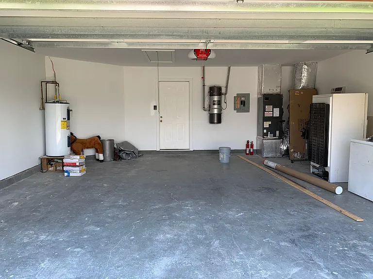 Garage with door to kitchen.