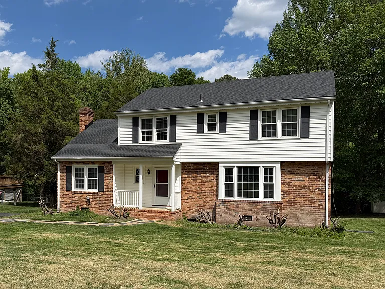 Beautiful two-story colonial on a private street with a paved driveway