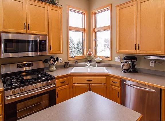 A closer view of the kitchen and custom cabinets.