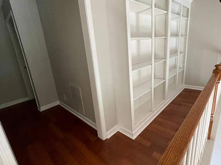 Upstairs landing with built-in bookshelves