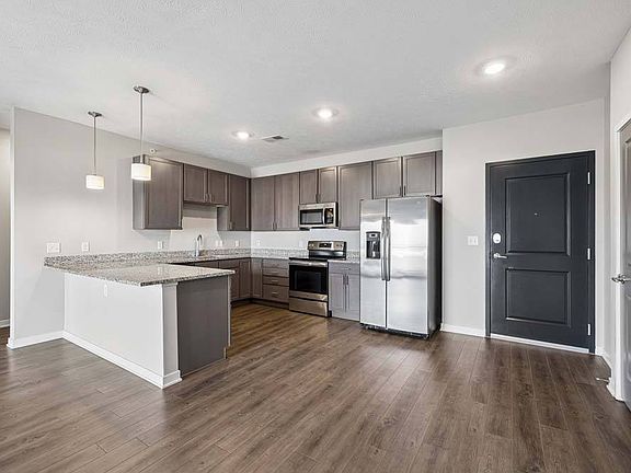 Contemporary finishes, generous prep space, and an open layout make this kitchen the perfect centerpiece for everyday living.