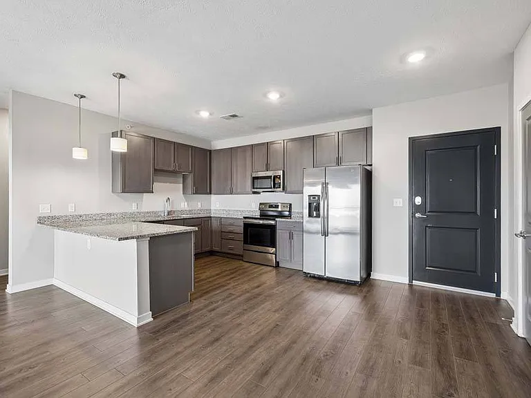 Contemporary finishes, generous prep space, and an open layout make this kitchen the perfect centerpiece for everyday living.