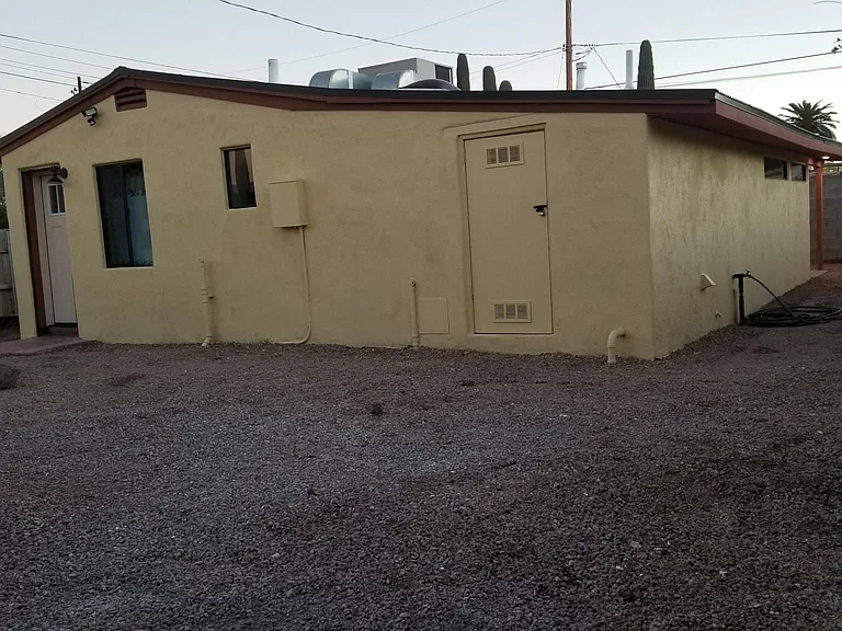Rear of house with large back yard.