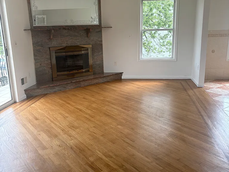Living room with wood burning fire place
