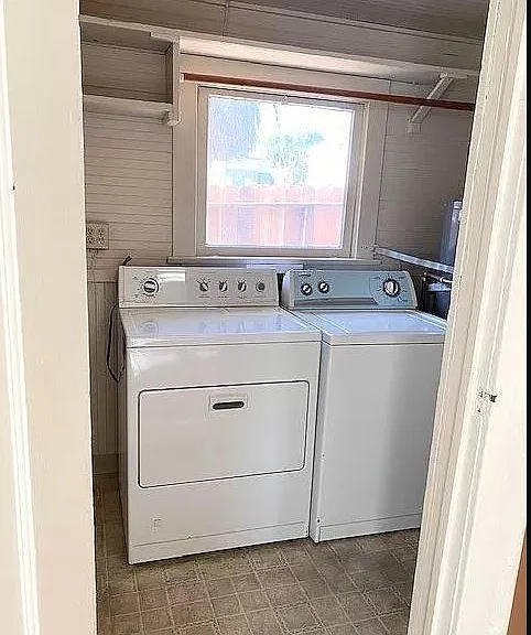 Full size washer and dryer in separate laundry/utility room
