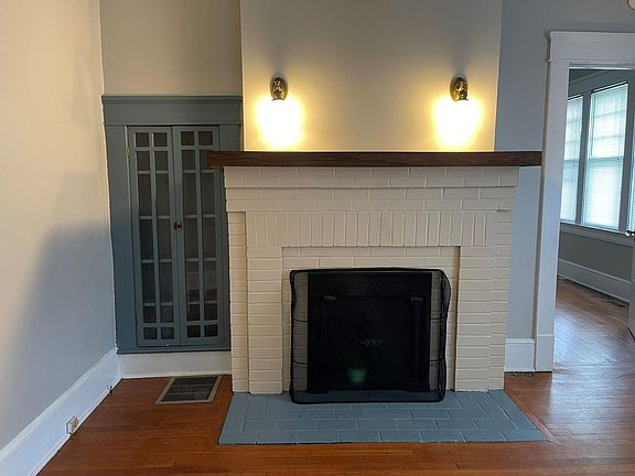 Living room with fireplace and built-in cabinets