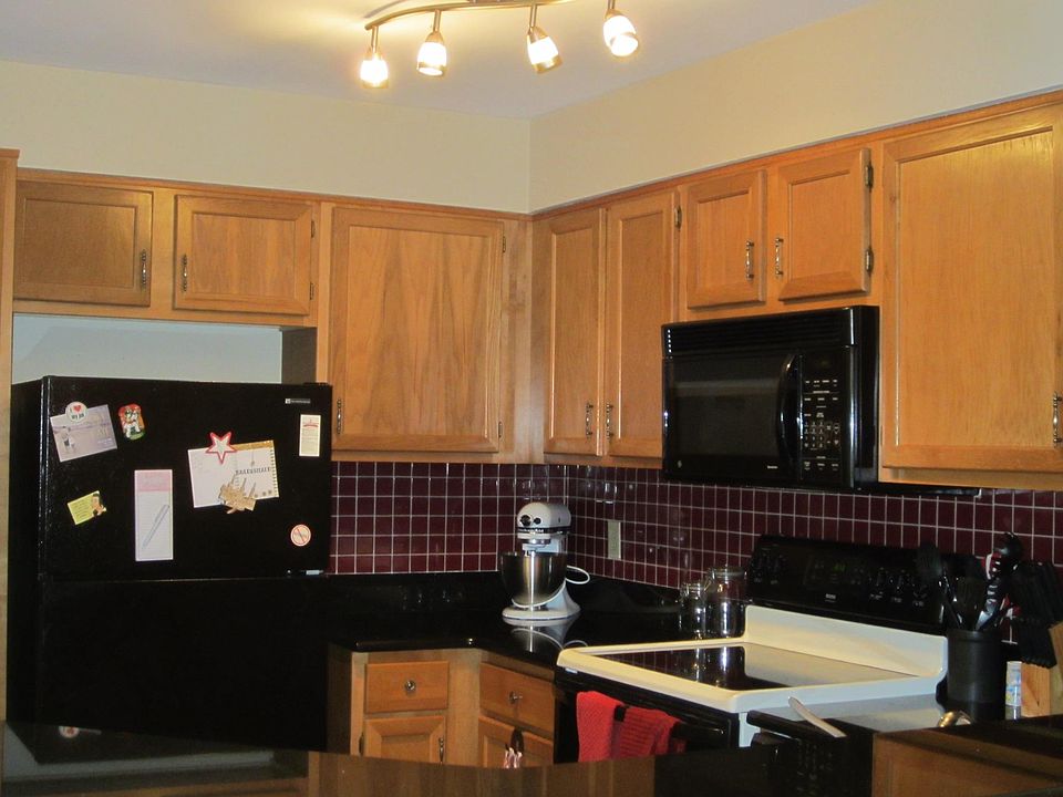 Kitchen with ample storage and granite countertops. Built in microwave and dishwasher.