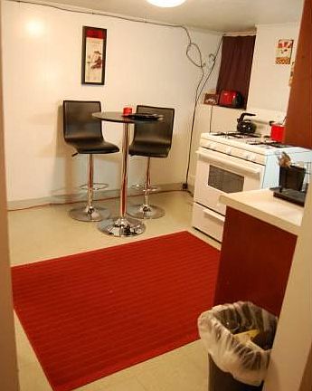 Separate eat-in kitchen with new gas stove and large stainle