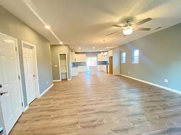 Open floor concept living room leading to the kitchen