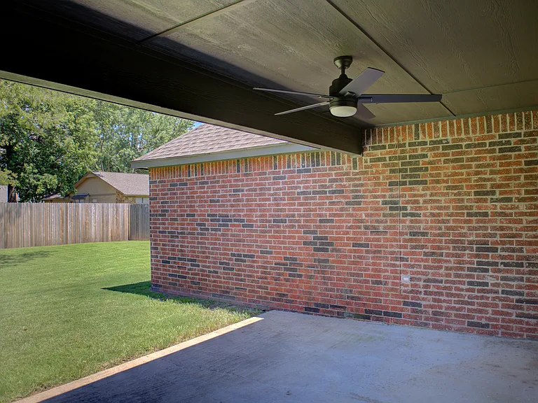 covered back patio w/ fan
