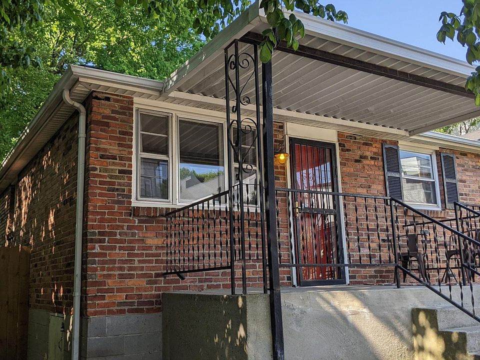 Covered front porch. Room for a small table and chairs.