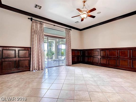 LIVING ROOM,GLASS DOORS TO PATIO,VIEW OF GOLF COURSE,POOL,SPA