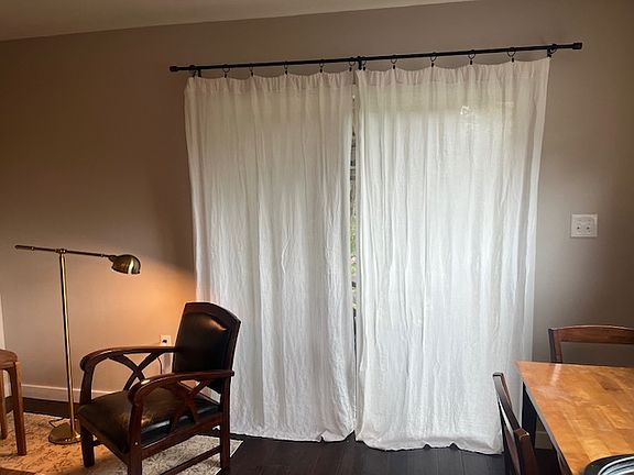 Large sliding door (with screen) opens to covered side deck.