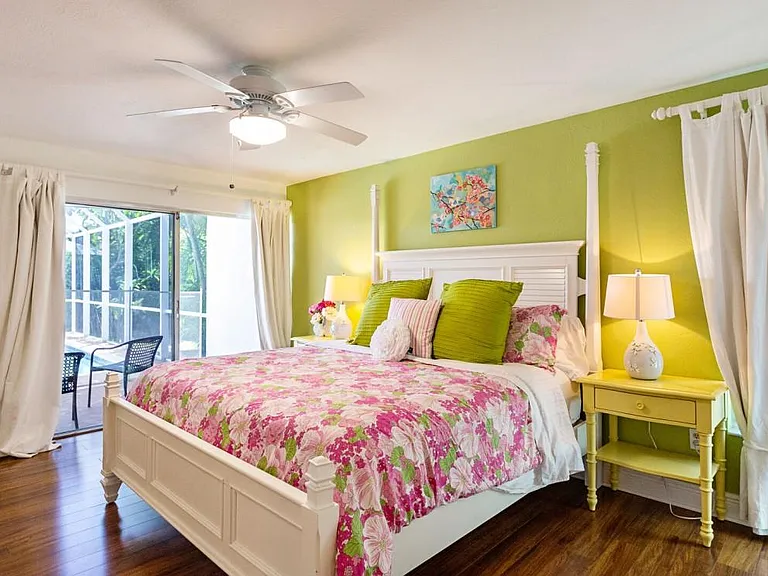 Master bedroom with view of patio