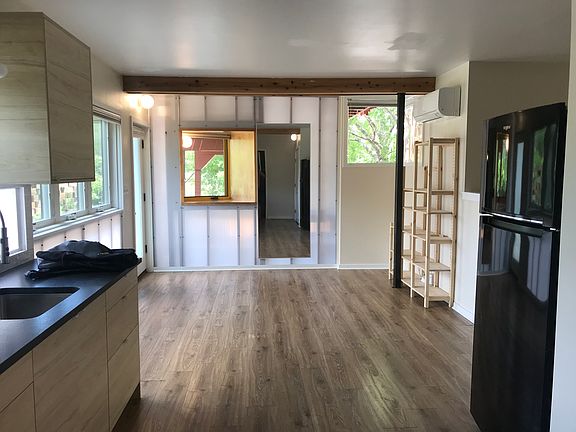 New Ikea cabinets and black granite countertop in 2025, view to the east