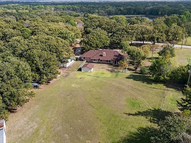 Aerial view from the back of the property, barn and storage building in lower left hand corner.