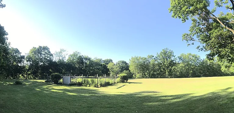Pano view of park land behind the house