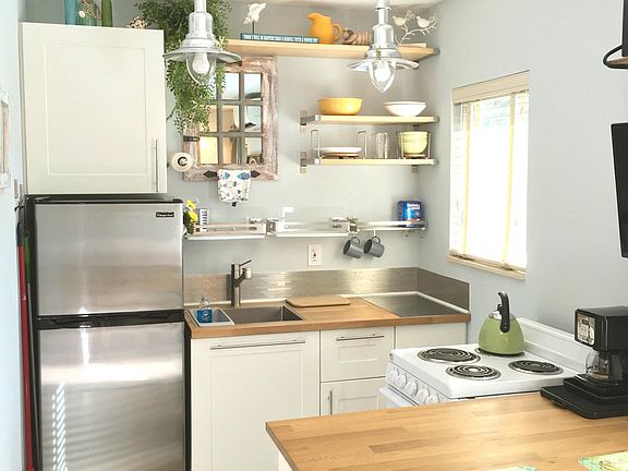 Kitchen with plenty of storage shelves.