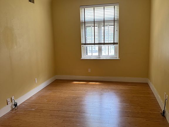 Living area with large front window.