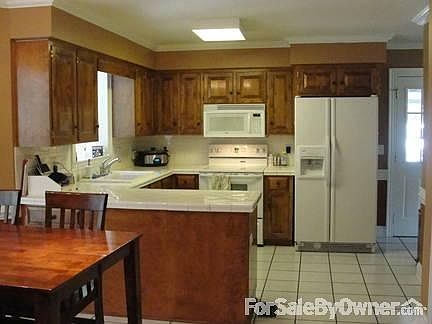 Sun Room
						:
						The sun room includes a gas fireplace. This room overlooks the pool area.