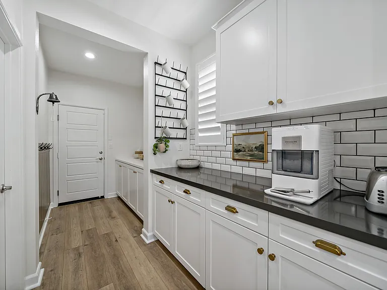 Butler's Pantry, walk in pantry & mud room with garage access
