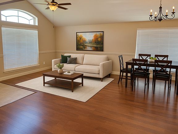 Formal living and dining. Photo virtually staged.