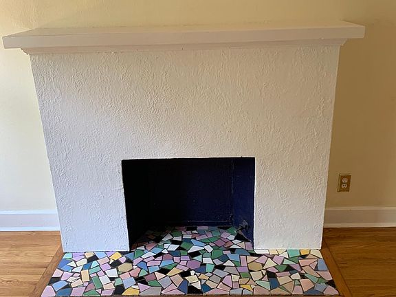 faux fireplace with mosaic tile