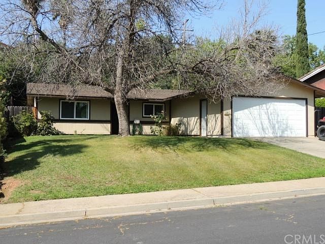 Front exterior, up-slope from the street.