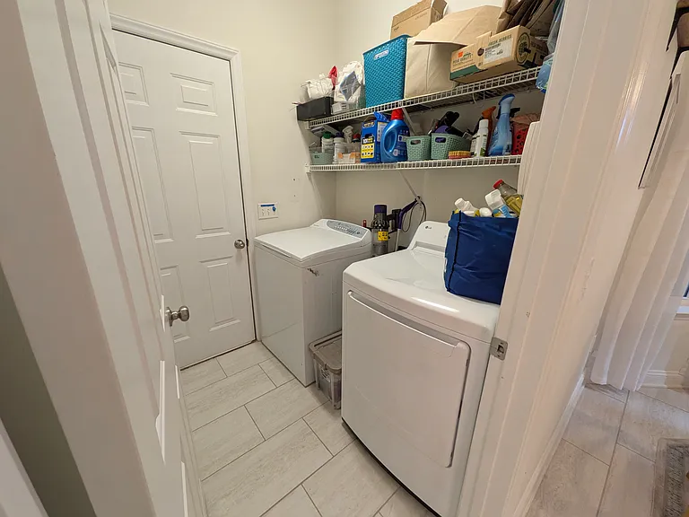 Laundry / Mud Room
Convenient laundry and mud room connected directly to the two-car garage. Includes standard washer and dryer hookups, allowing tenants to bring their own appliances. Provides additional space for storage and everyday organization.