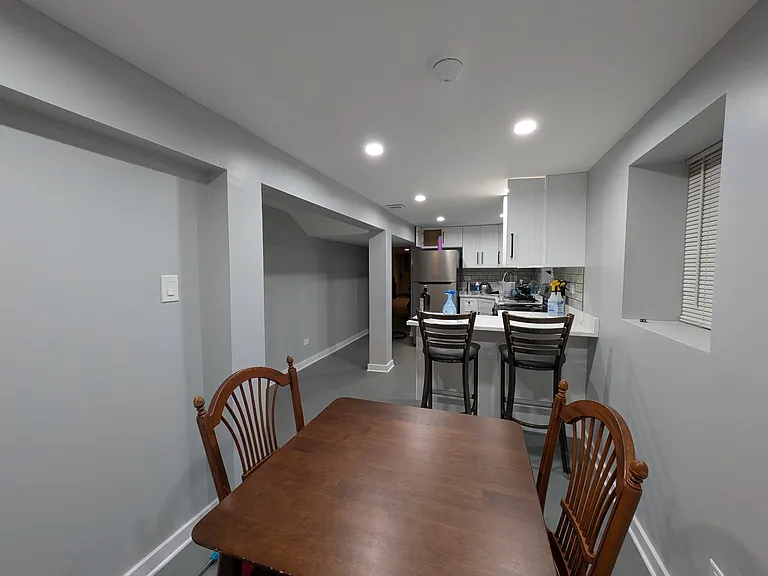 Kitchen has built in seating and room for a small table.
