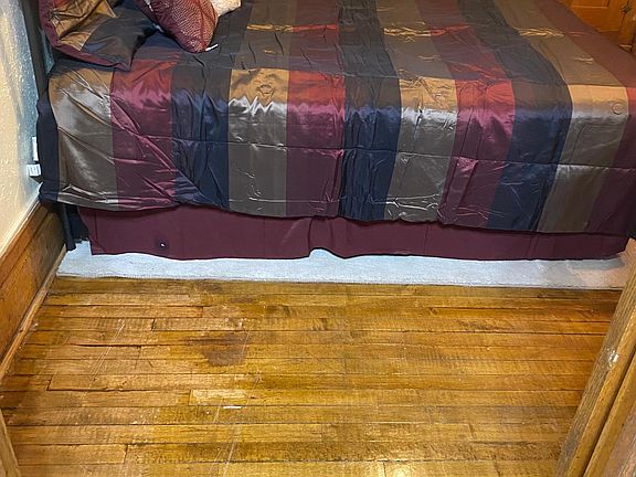 Refinished wood in LR & BR is GORGEOUS. (in background TWO huge armoires-no closets in 1900!)