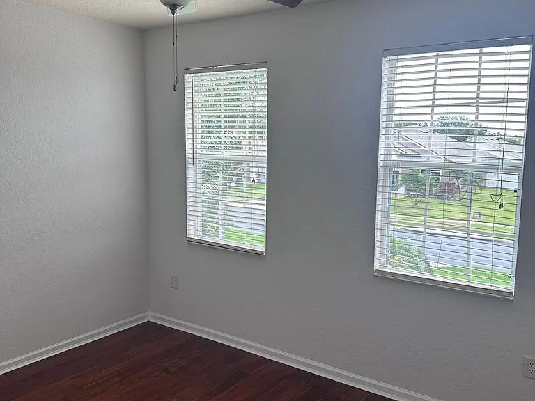 Guset living room with warm Brazilian wood flooring.