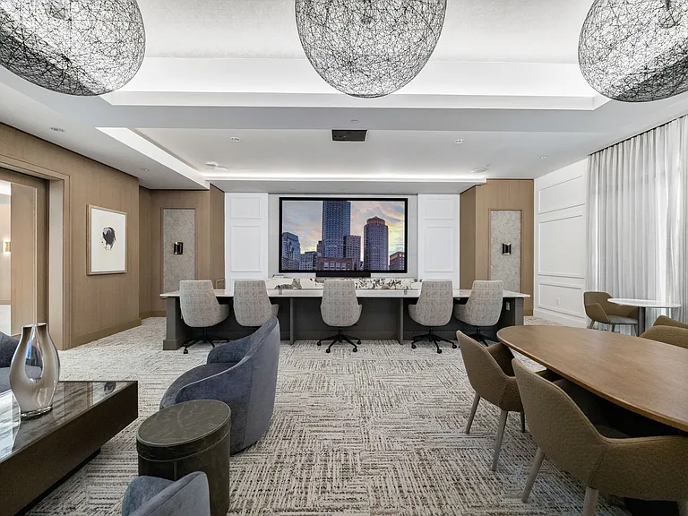 Media lounge with both lounge and theater seating and multiple TVs