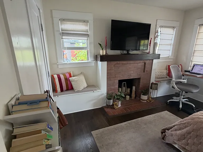 built-in storage cabinets beside fireplace