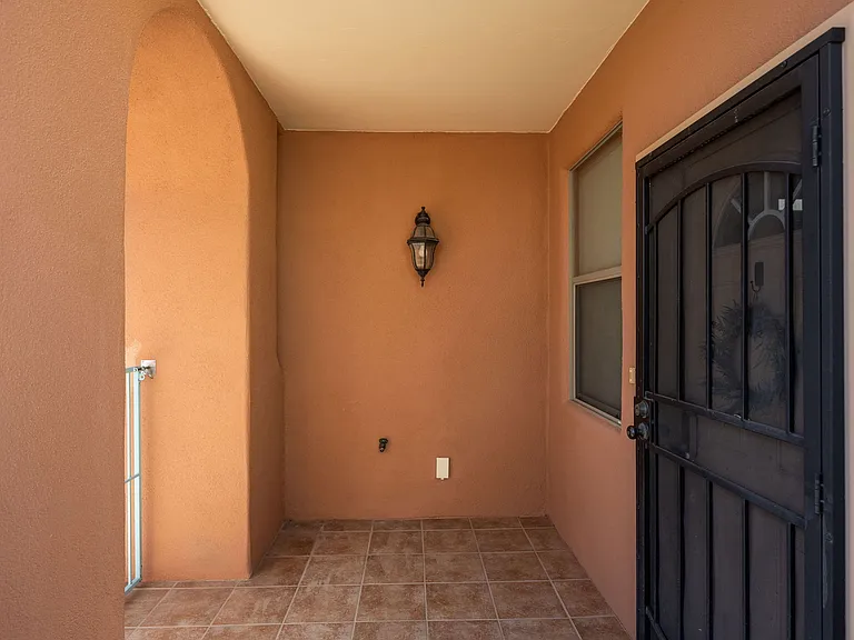 Metal security doors front & back. Catch a glimpse of the Organ Mountain views from the courtyard.