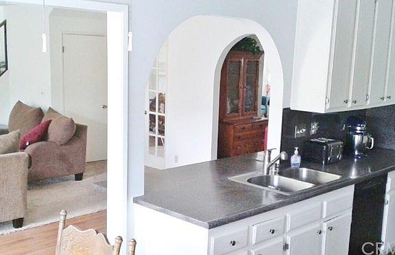 Custom arches and an open floorplan kitchen leading to both the Family Room on one side and the Dining Room on the other side.  This home was built for entertaining!