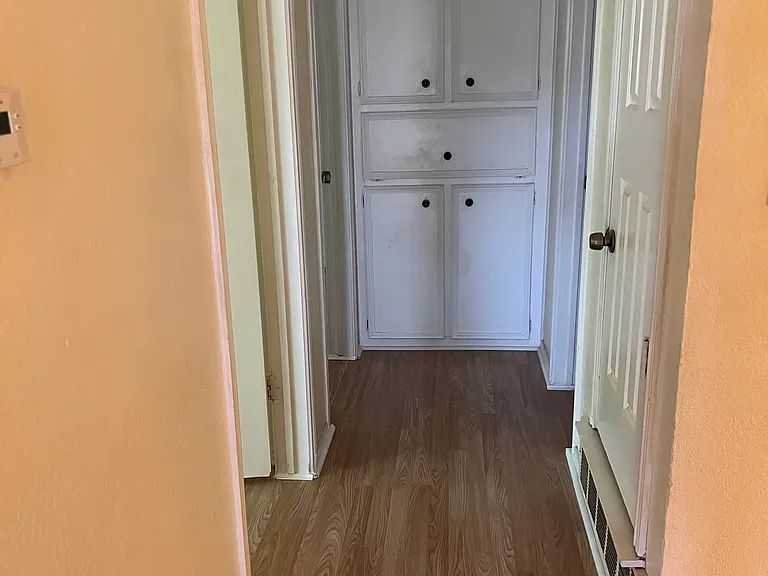 Second Floor Hall has custom storage for linen and dirty clothes bin the HVAC system door is to the right with its own thermostat turn the HVAC downstair low at bedtime sleep comfy upstairs save a bundle on the electric