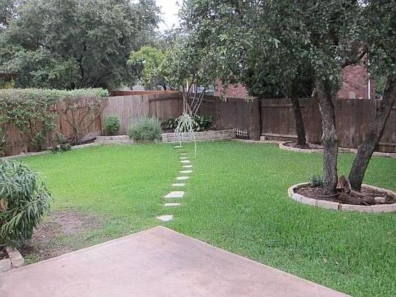 NICE TREE SHADED BACK YARD