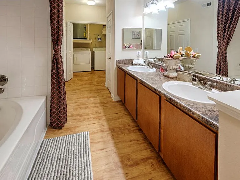 Estancia Model Main Bathroom view to Laundry rm