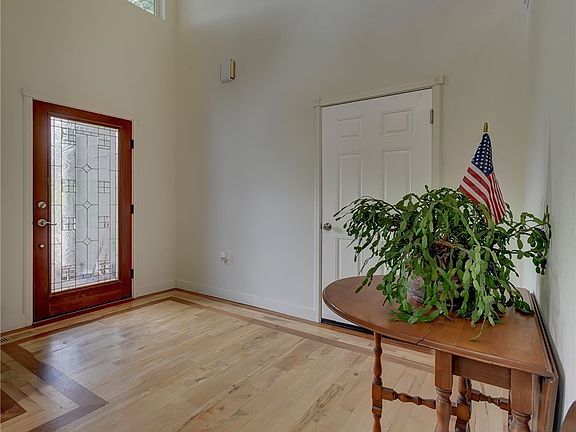Welcoming main entry. Door to garage.