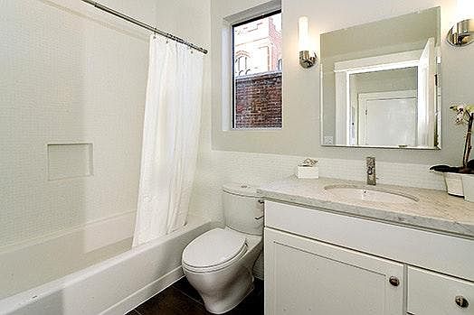 Main bathroom with marble counters, heated floors & large li